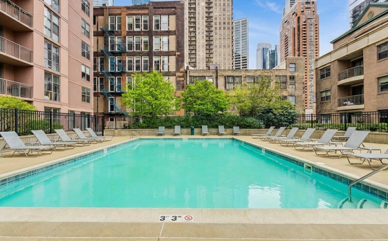 1155 South State Street, Unit 400 Chicago, IL 60605 - Photo 23 of 27 a swimming pool with outdoor seating and yard