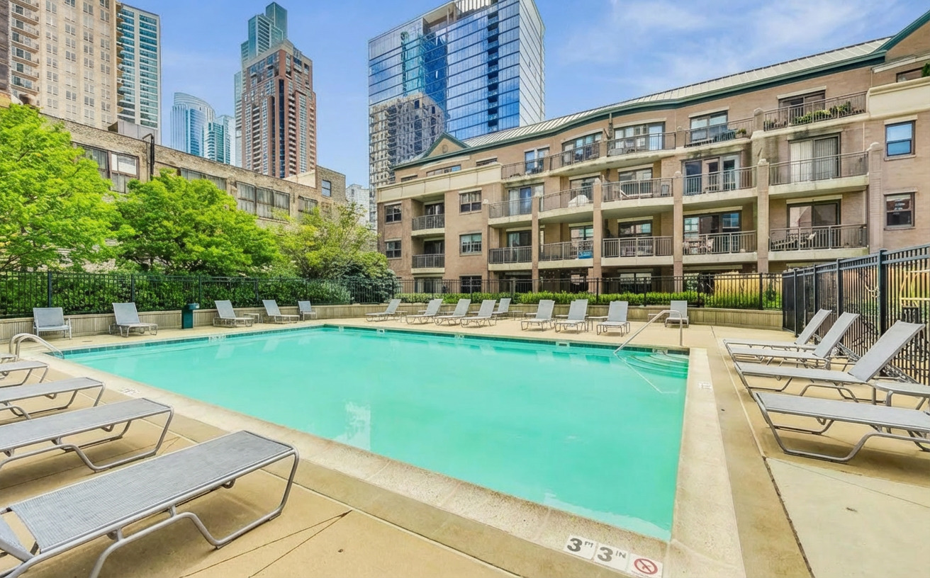 1155 South State Street, Unit 400 Chicago, IL 60605 - Photo 24 of 27 a view of a swimming pool with a lounge chairs