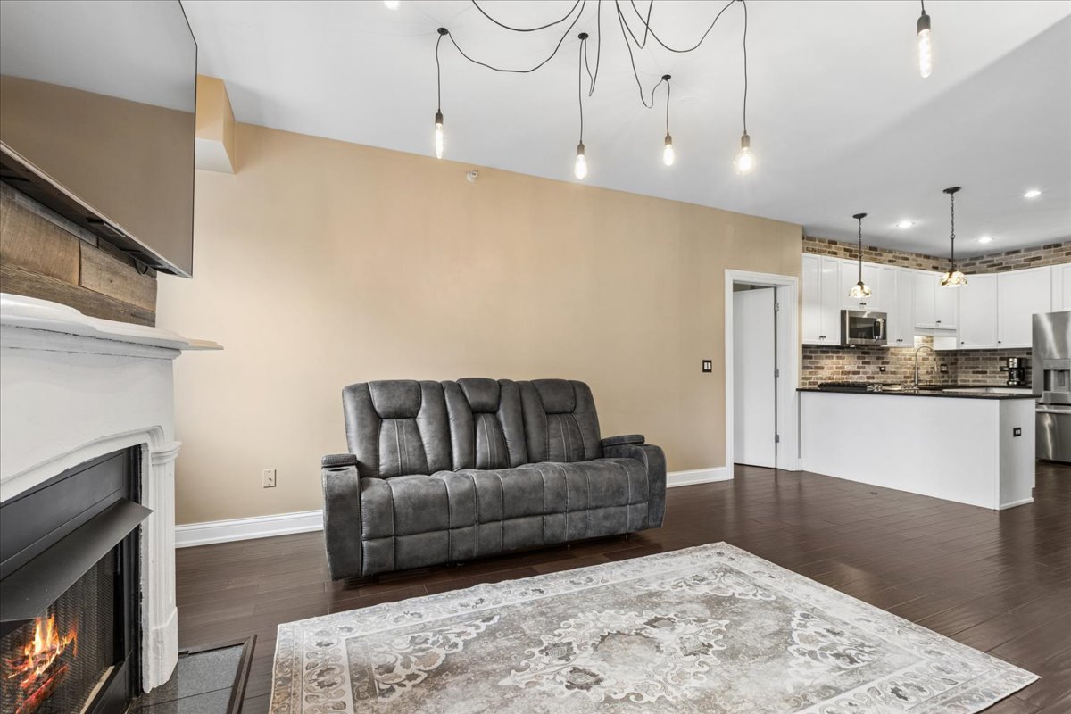 1155 South State Street, Unit 400 Chicago, IL 60605 - Photo 3 of 27 a living room with furniture and a fireplace