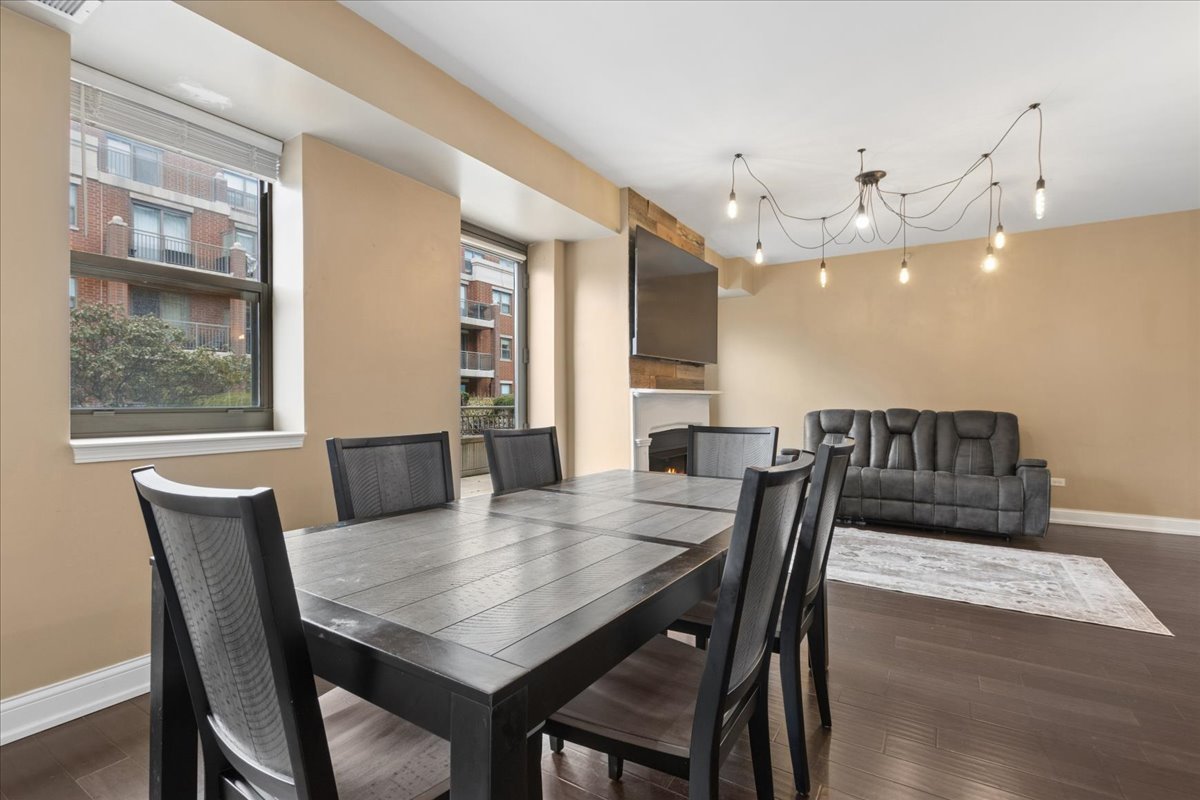 1155 South State Street, Unit 400 Chicago, IL 60605 - Photo 6 of 27 a view of a dining room with furniture and wooden floor