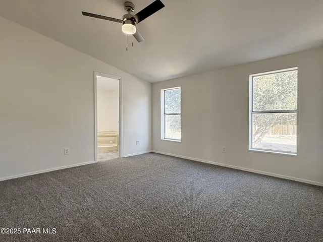 an empty room with closet area