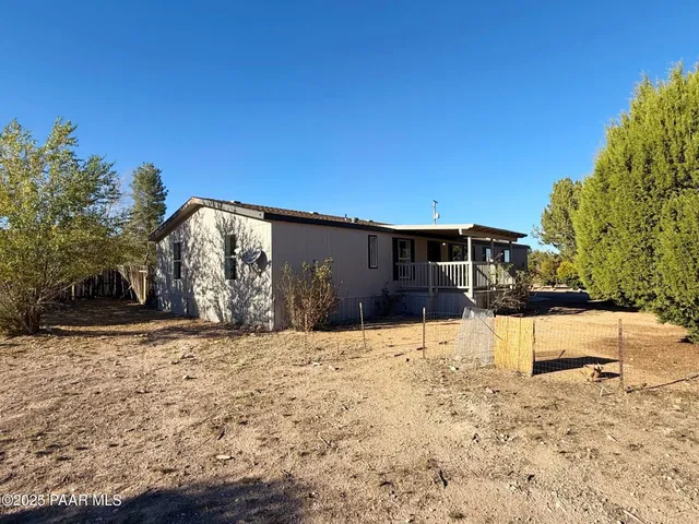 a view of a backyard of the house
