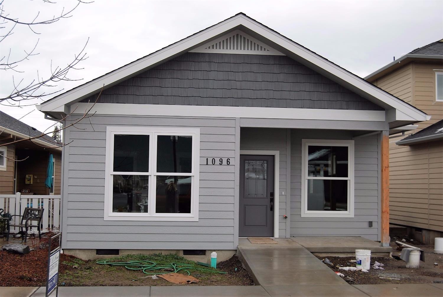 1096 Boulder Ridge Street Central Point, OR 97502 - Photo 1 of 24 Front view of home, vinyl post and lands