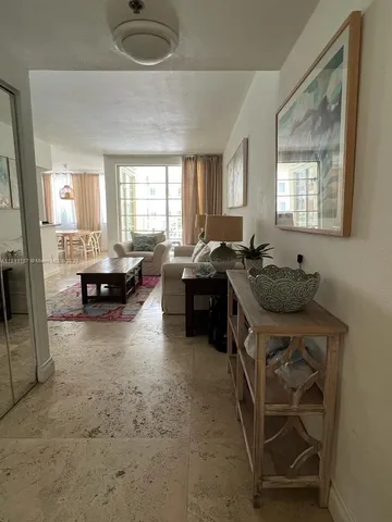 a kitchen with a sink and a refrigerator