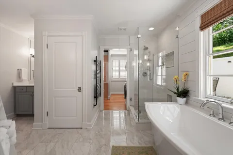 a bathroom with a shower and a sink