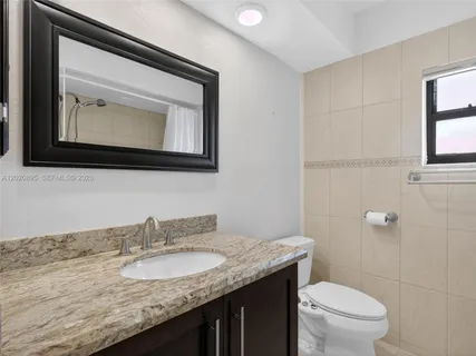 a bathroom with a bath tub and shower