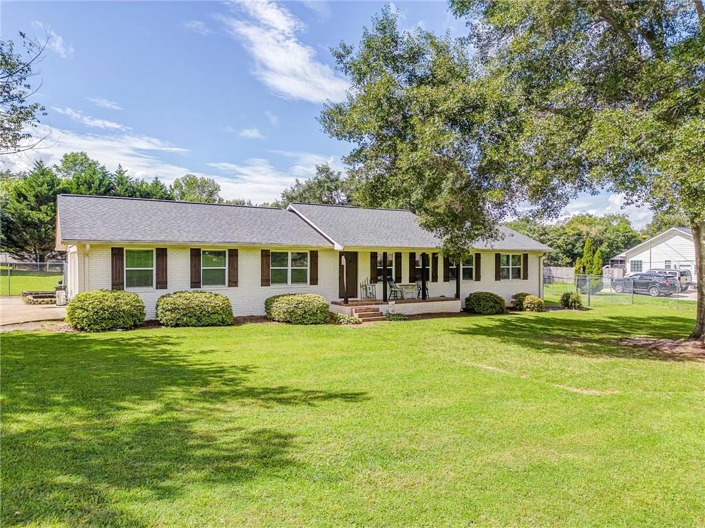 109 Lake Street Rockmart, GA 30153 - Photo 2 of 50 a front view of a house with a garden