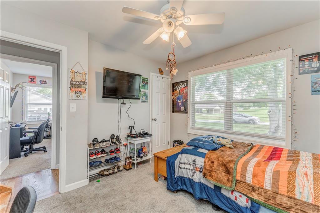 109 Lake Street Rockmart, GA 30153 - Photo 36 of 50 a bedroom with bed and a flat tv screen on dresser