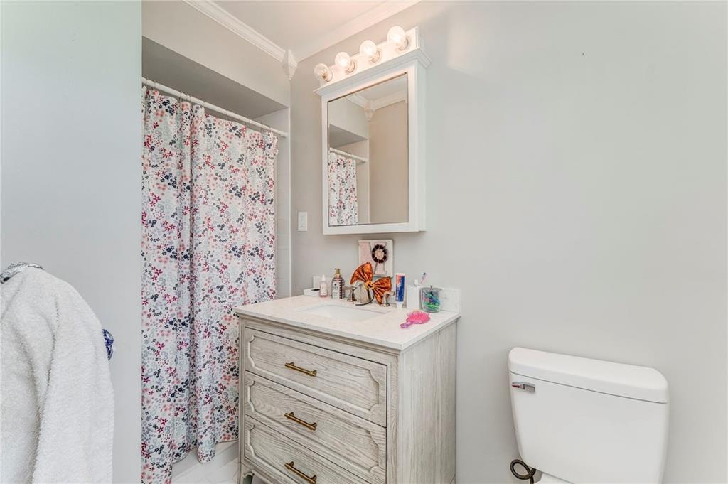 109 Lake Street Rockmart, GA 30153 - Photo 43 of 50 a bathroom with a sink toilet vanity and shower