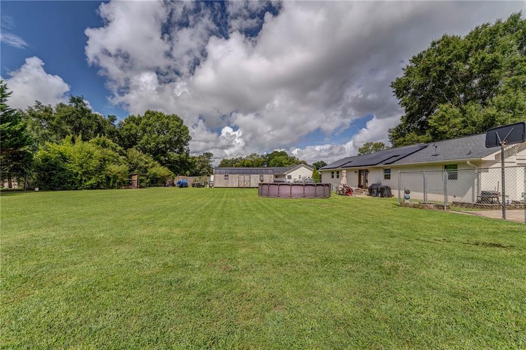 109 Lake Street Rockmart, GA 30153 - Photo 49 of 50 a view of a house with a big yard and large trees
