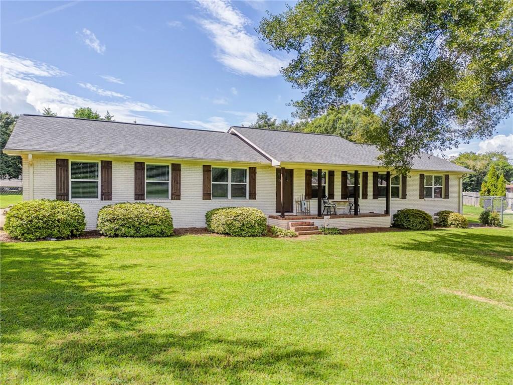 109 Lake Street Rockmart, GA 30153 - Photo 5 of 50 a front view of a house with swimming pool having outdoor seating