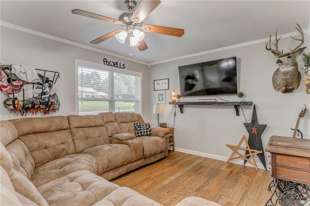 109 Lake Street Rockmart, GA 30153 - Photo 10 of 50 a living room with furniture and a flat screen tv
