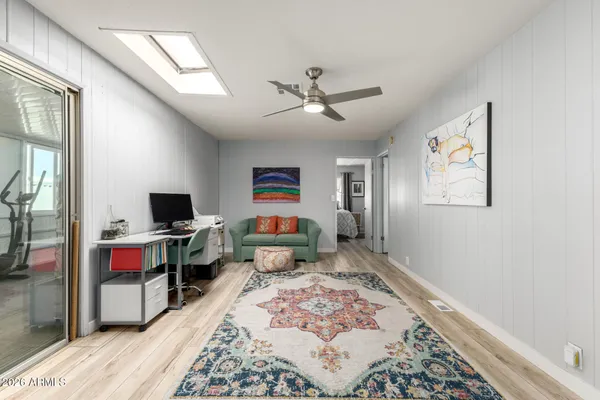 a dining room with furniture and wooden floor