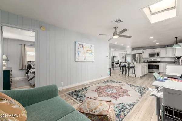 a bed room with a bed and a flat screen tv