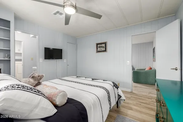 a bedroom with a bed and a window