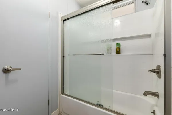 a bathroom with a sink toilet vanity and granite