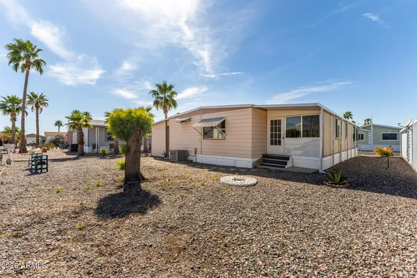 a house with a tree in the background