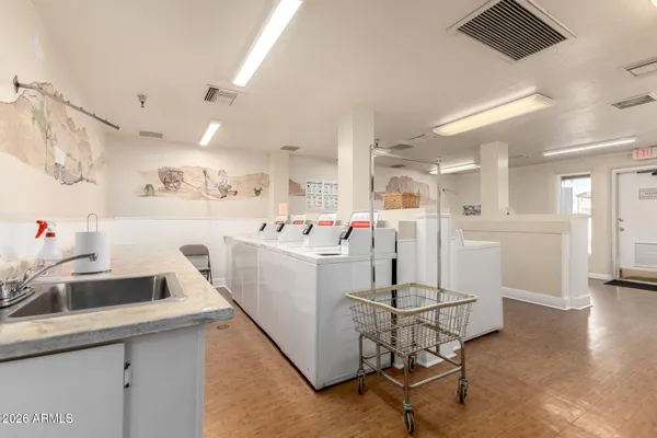 a room with furniture and pool table