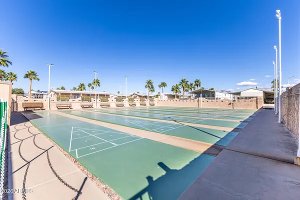 a view of a house with swimming pool and sitting area