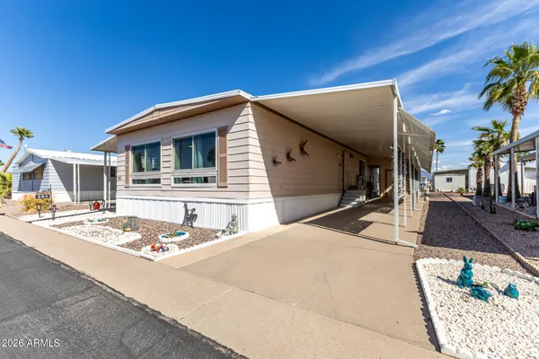 a view of a house with a street