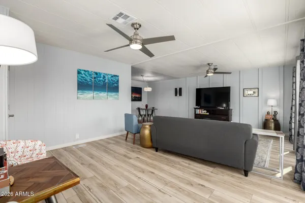 a living room with furniture and a large window