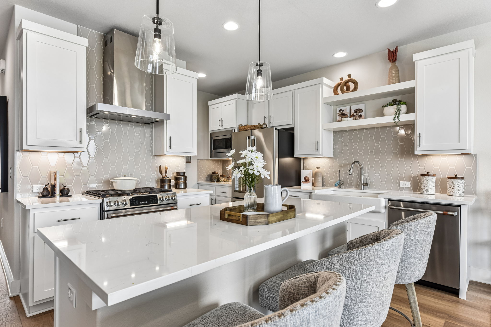 9033 Cattle Baron Path Austin, TX 78747 - Photo 11 of 40 Culinary delights await in this bright kitchen with a spacious island, pendant lighting, and ample cabinetry.