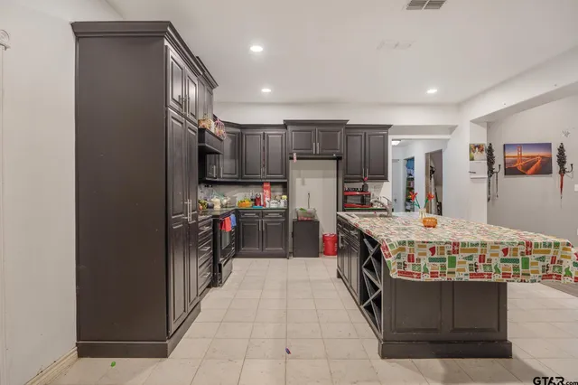 a kitchen with kitchen island granite countertop lots of counter top space
