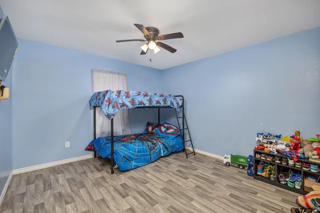 a bedroom with furniture and a chandelier