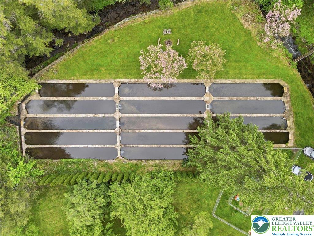 3585 Fairyland Road Lehighton, PA 18235 - Photo 55 of 57 An aerial perspective reveals a unique multi-pond water feature amidst verdant landscaping.