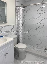 16121 Southwest 141st Avenue Miami, FL 33177 - Photo 11 of 11 a bathroom with a toilet sink and shower