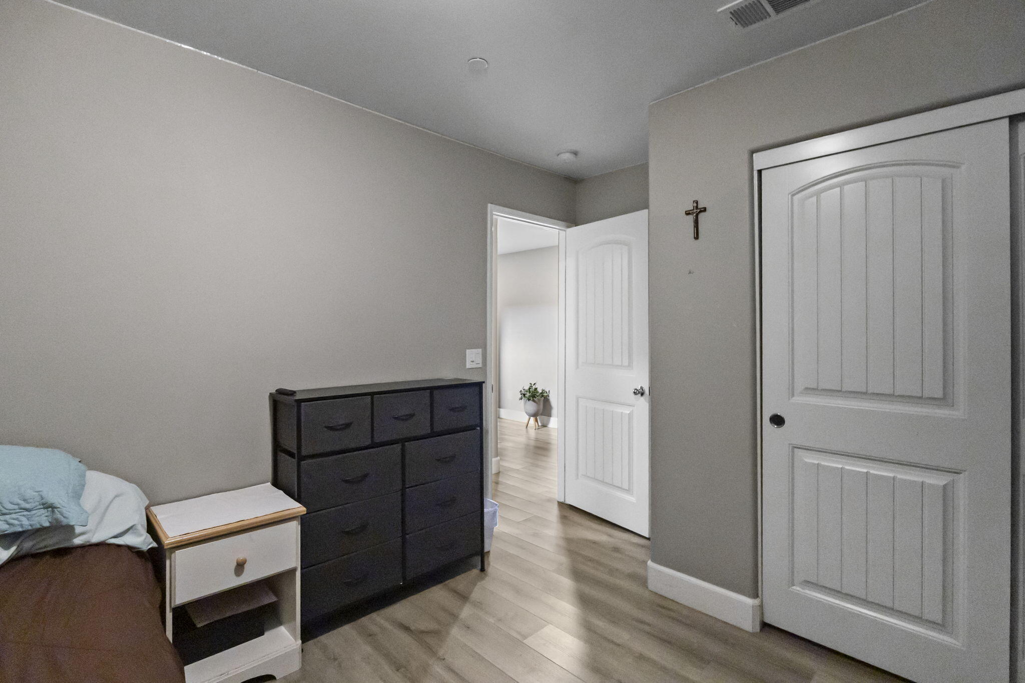 32486 Roman Warren Way Winchester, CA 92596 - Photo 19 of 45 a view of a bedroom with wooden floor and closet
