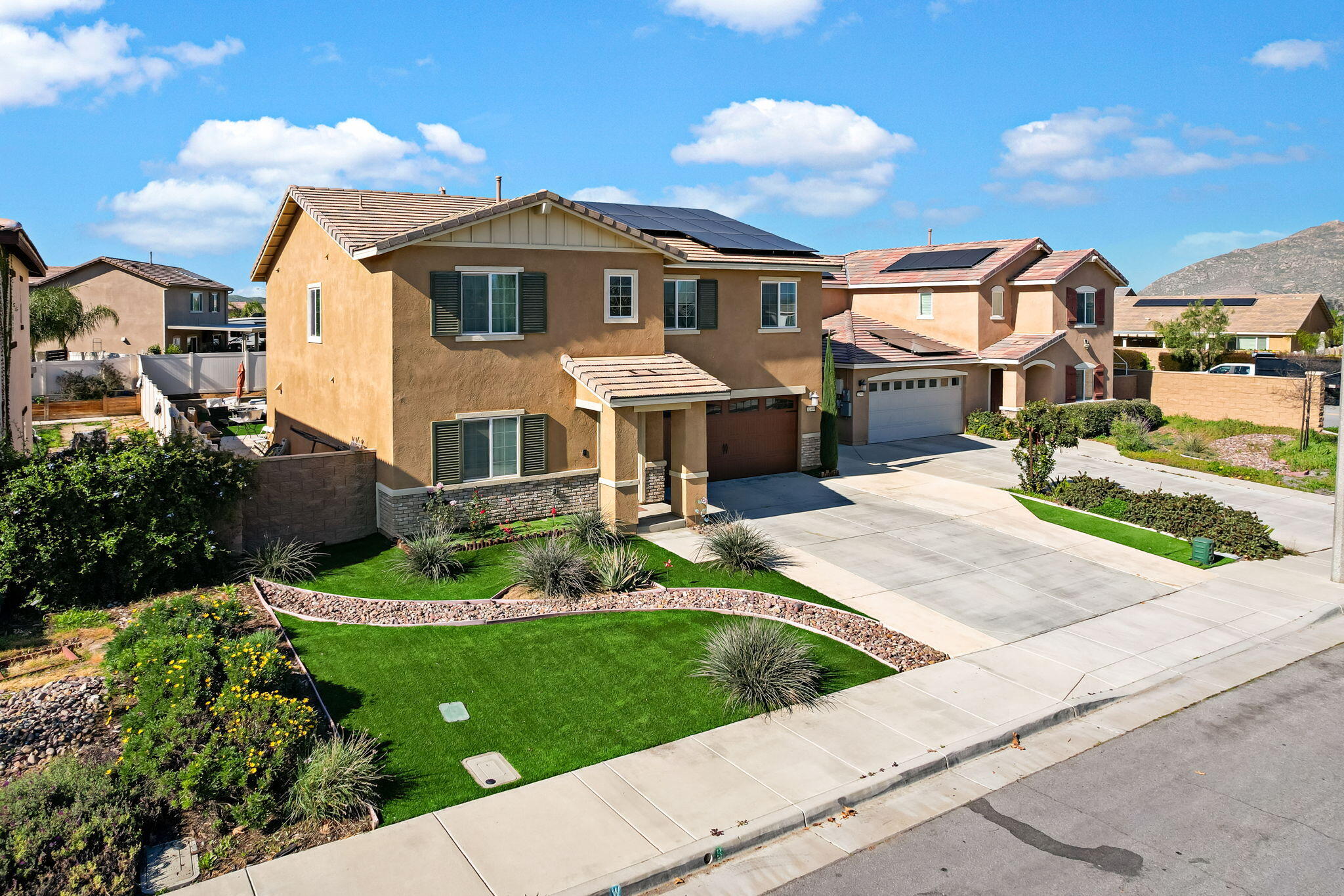 32486 Roman Warren Way Winchester, CA 92596 - Photo 2 of 45 a front view of a house with a yard