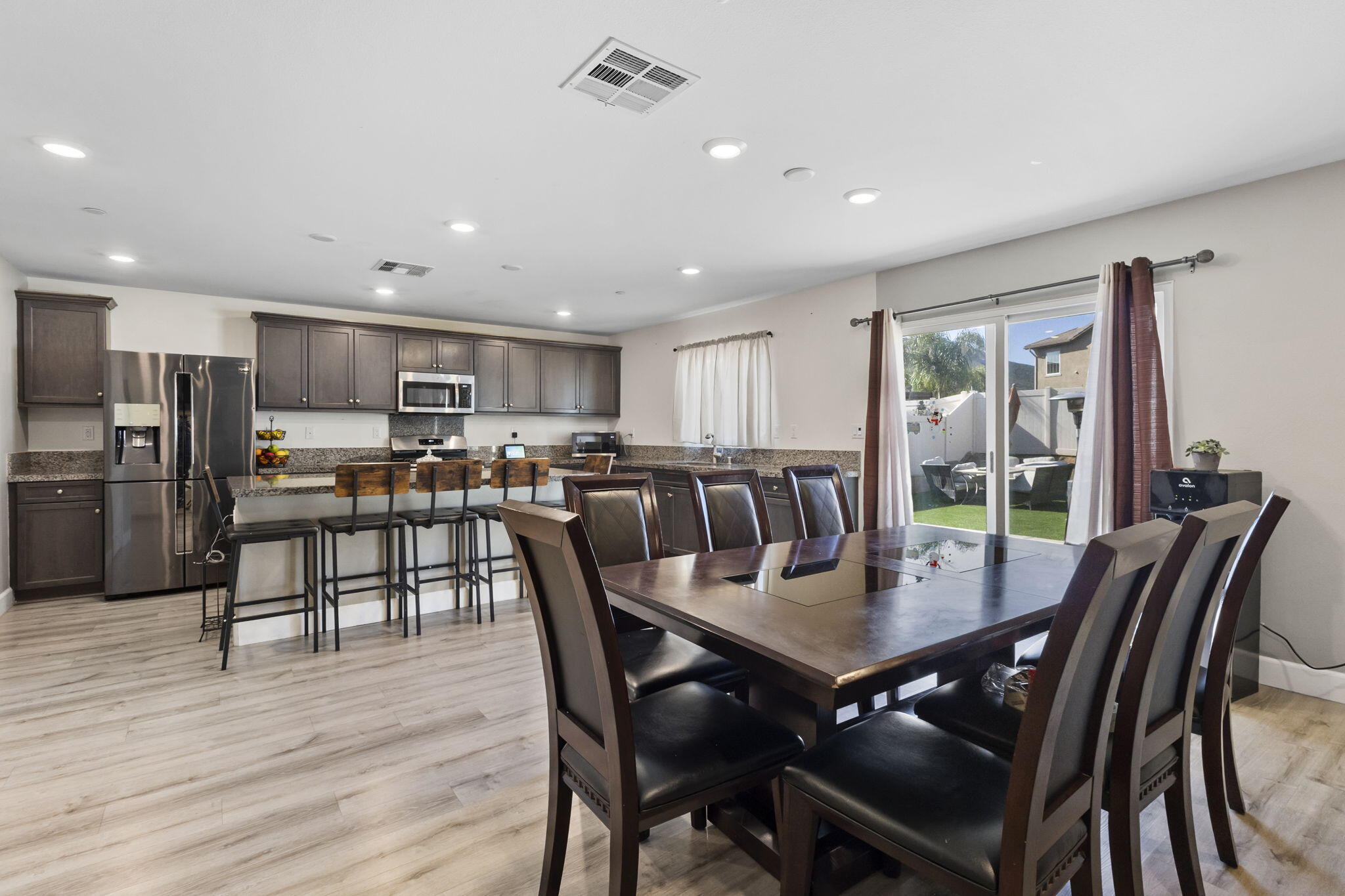32486 Roman Warren Way Winchester, CA 92596 - Photo 26 of 45 a view of a dining room with furniture