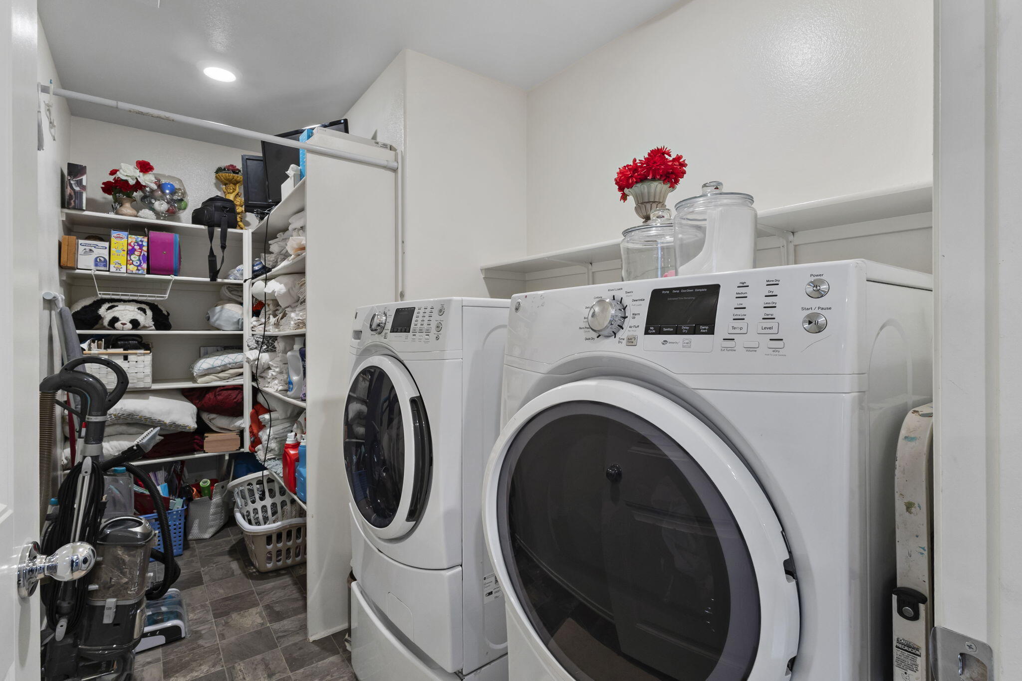 32486 Roman Warren Way Winchester, CA 92596 - Photo 29 of 45 a utility room with dryer washer and closet