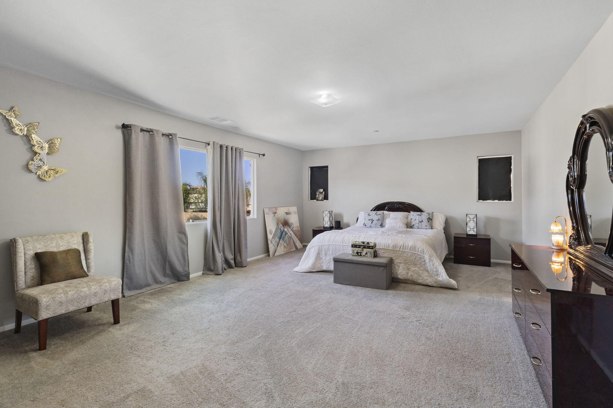 32486 Roman Warren Way Winchester, CA 92596 - Photo 30 of 45 a bedroom with a bed and a chair