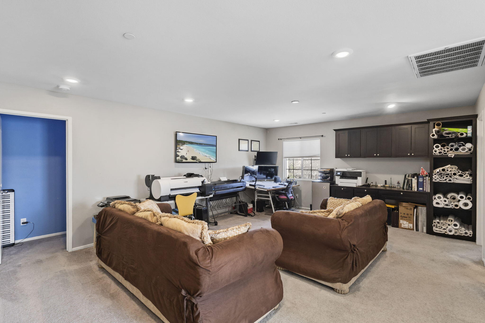 32486 Roman Warren Way Winchester, CA 92596 - Photo 34 of 45 a living room with furniture and a flat screen tv