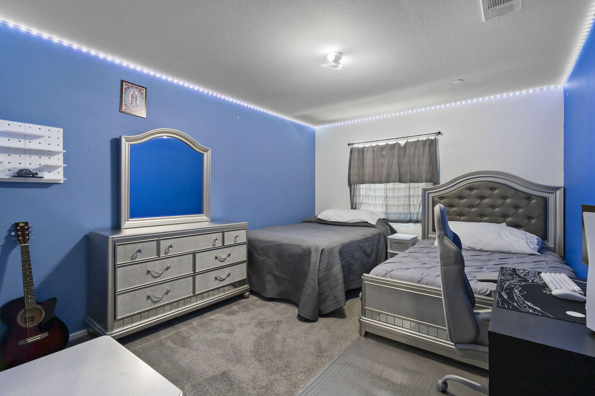 32486 Roman Warren Way Winchester, CA 92596 - Photo 39 of 45 a bedroom with a bed and a dresser