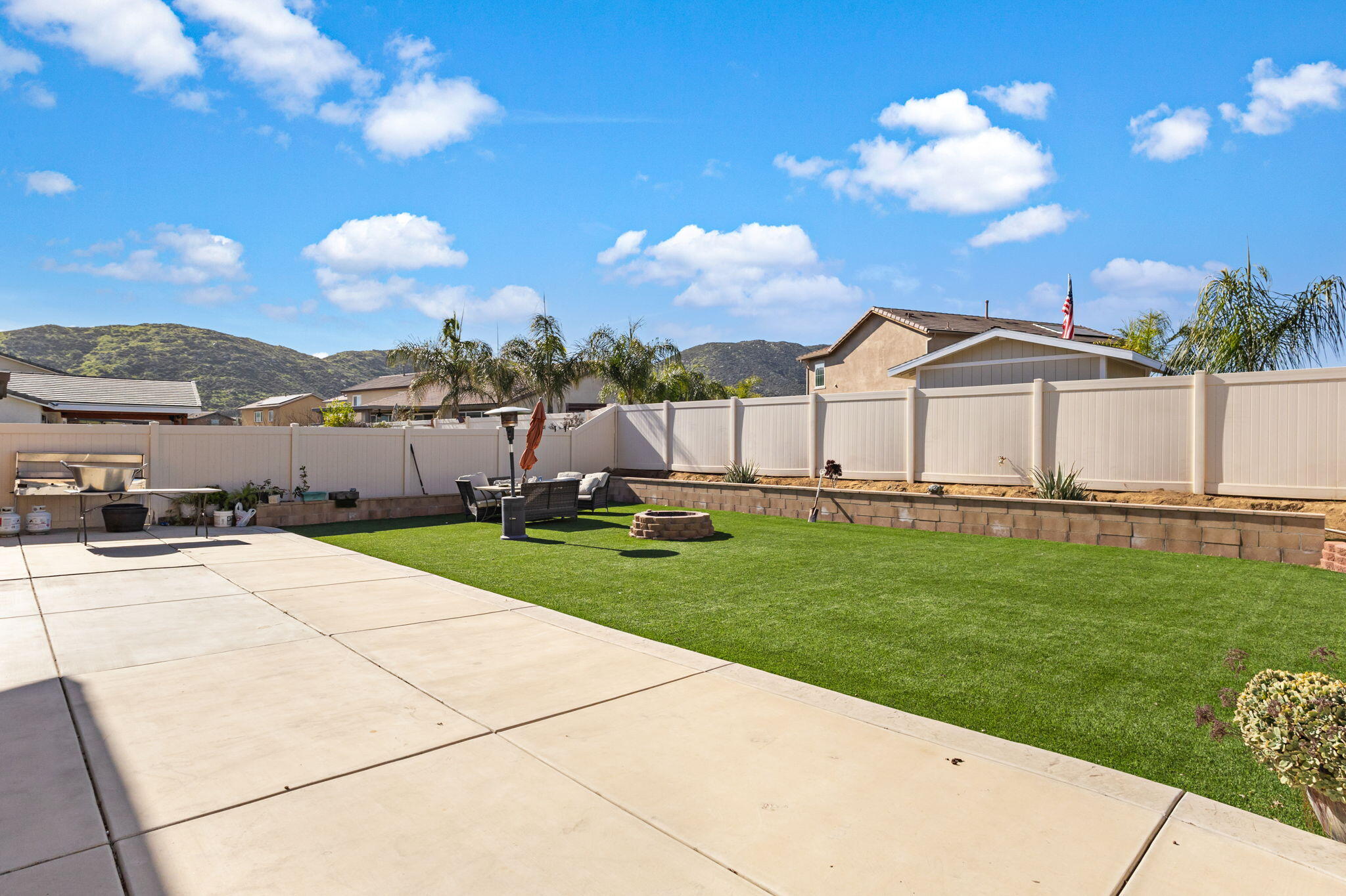32486 Roman Warren Way Winchester, CA 92596 - Photo 42 of 45 a view of a garden with an buildings and a yard