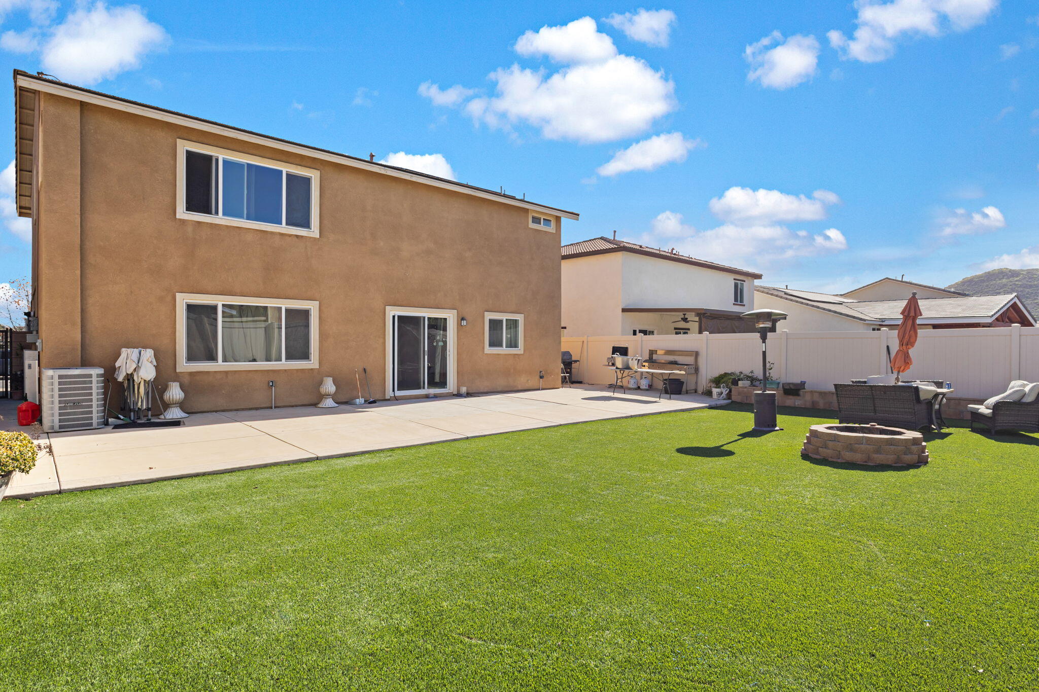 32486 Roman Warren Way Winchester, CA 92596 - Photo 43 of 45 a view of a house with backyard porch and sitting area
