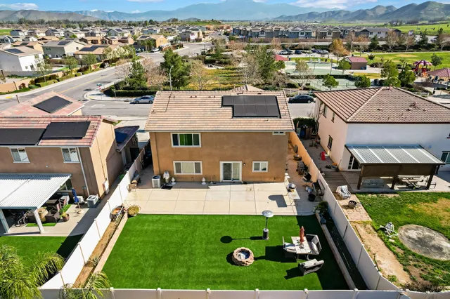 an aerial view of a house with a garden