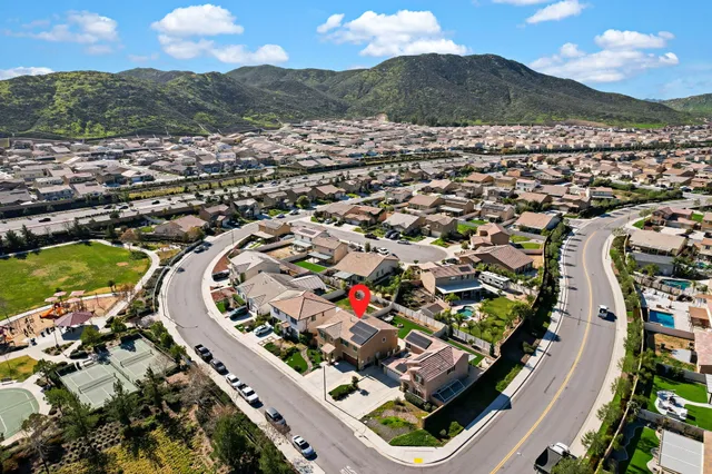 an aerial view of residential houses with outdoor space