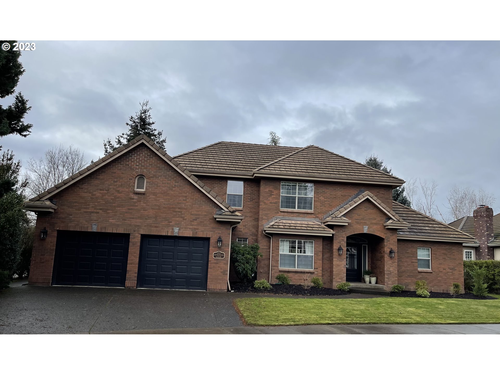 a front view of a house with a yard