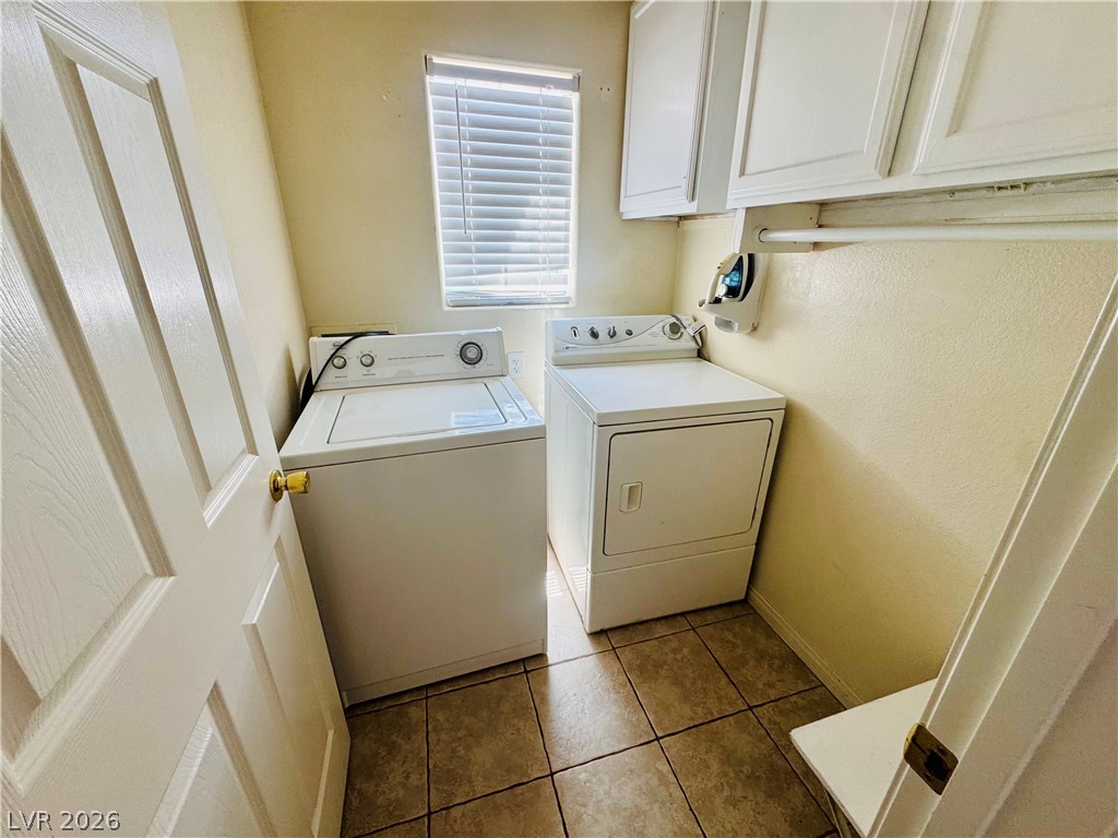 8920 Argus Reed Avenue Las Vegas, NV 89148 - Photo 5 of 10 This dedicated laundry space combines practicality with convenience.