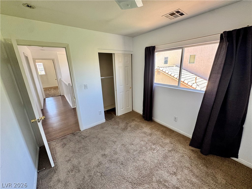 8920 Argus Reed Avenue Las Vegas, NV 89148 - Photo 8 of 10 This cozy bedroom features comfortable flooring and a view of the neighborhood.