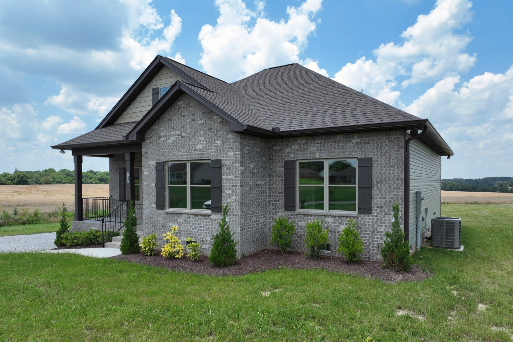725 Lear Road Portland, TN 37148 - Photo 3 of 50 a front view of a house with a garden and yard