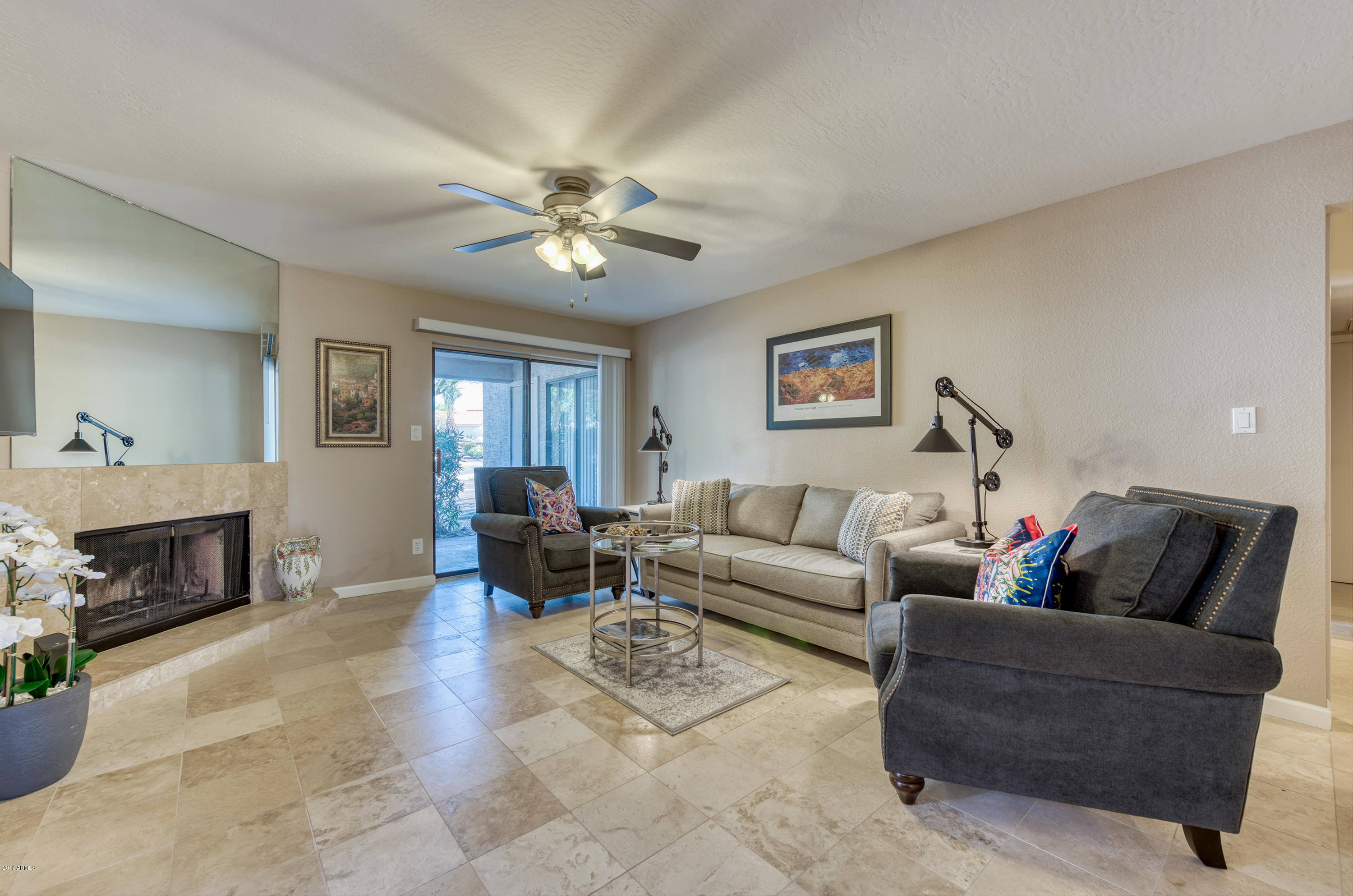 9445 North 94th Place, Unit 120 Scottsdale, AZ 85258 - Photo 4 of 17 Living Room ~ Patio