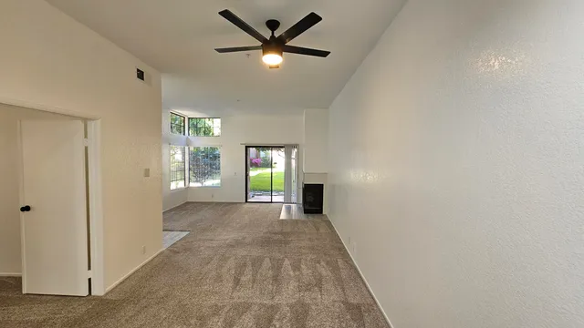 a view of a swimming pool and a yard