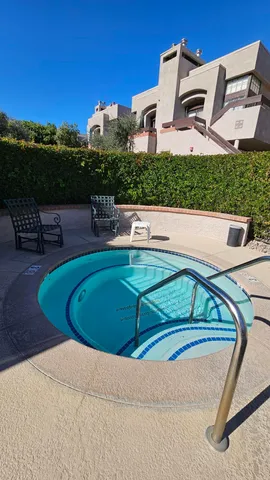 a view of a house with a yard porch and sitting area