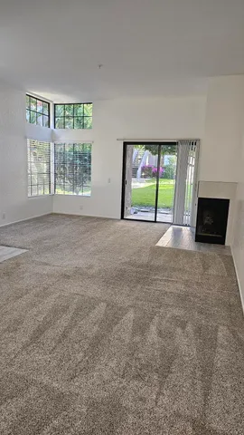 a kitchen with white cabinets and sink