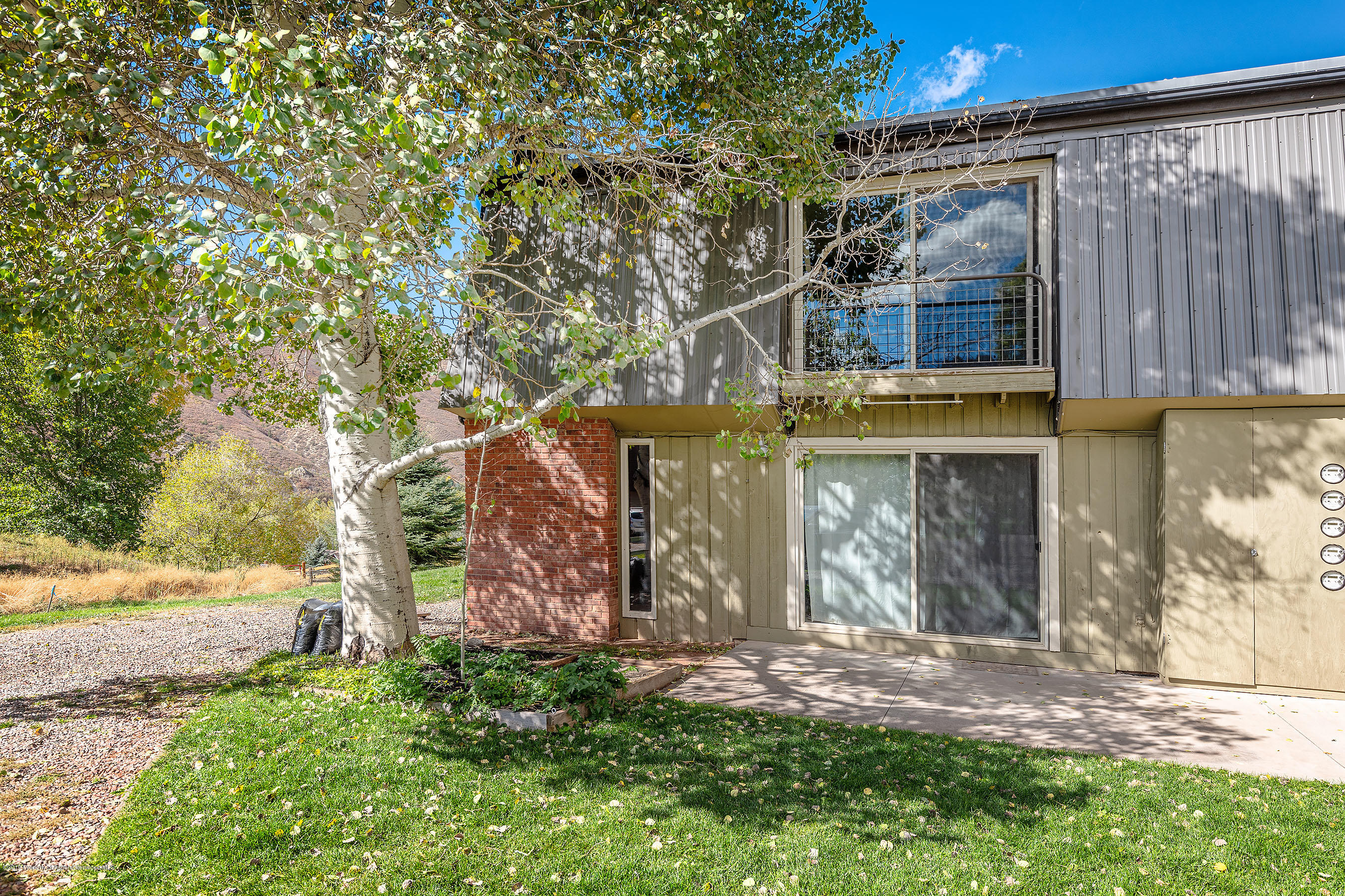 548 Holland Hills Road, Unit 4 Basalt, CO 81621 - Photo 17 of 20 a front view of house with a garden